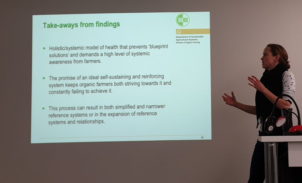 Rebecca presenting with slide summarising findings